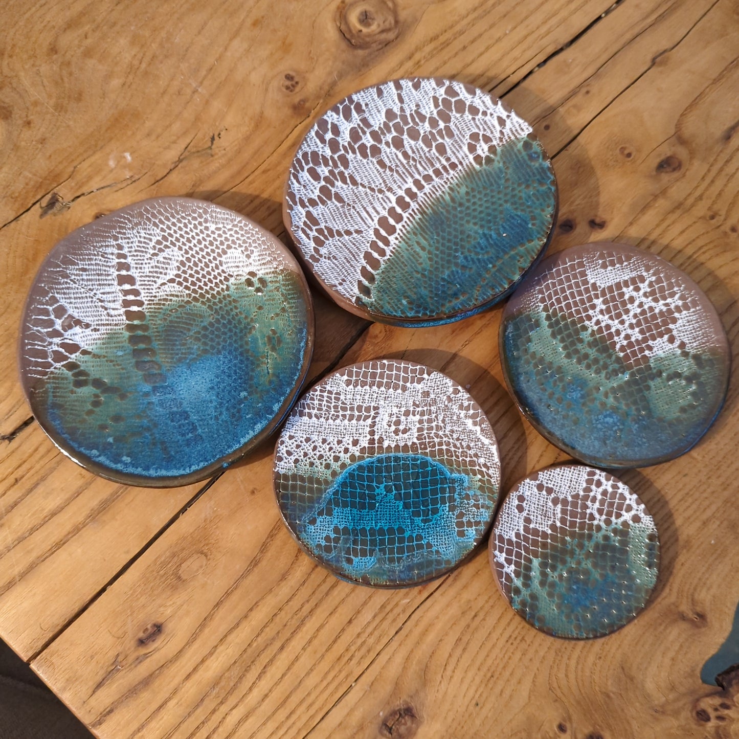 White lace and blue glaze on red clay