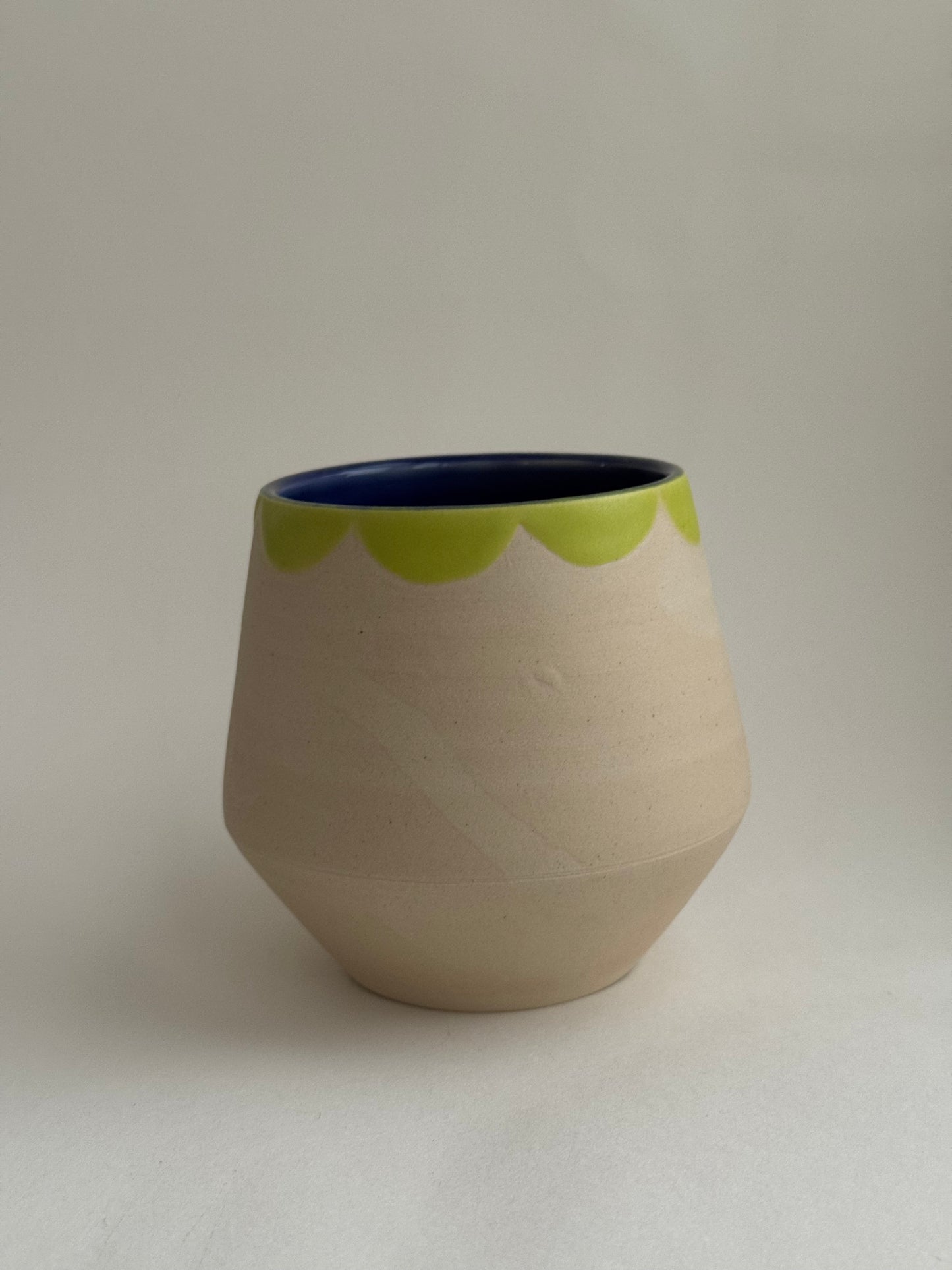 White and Green Cup Green Collar and Blue Interior