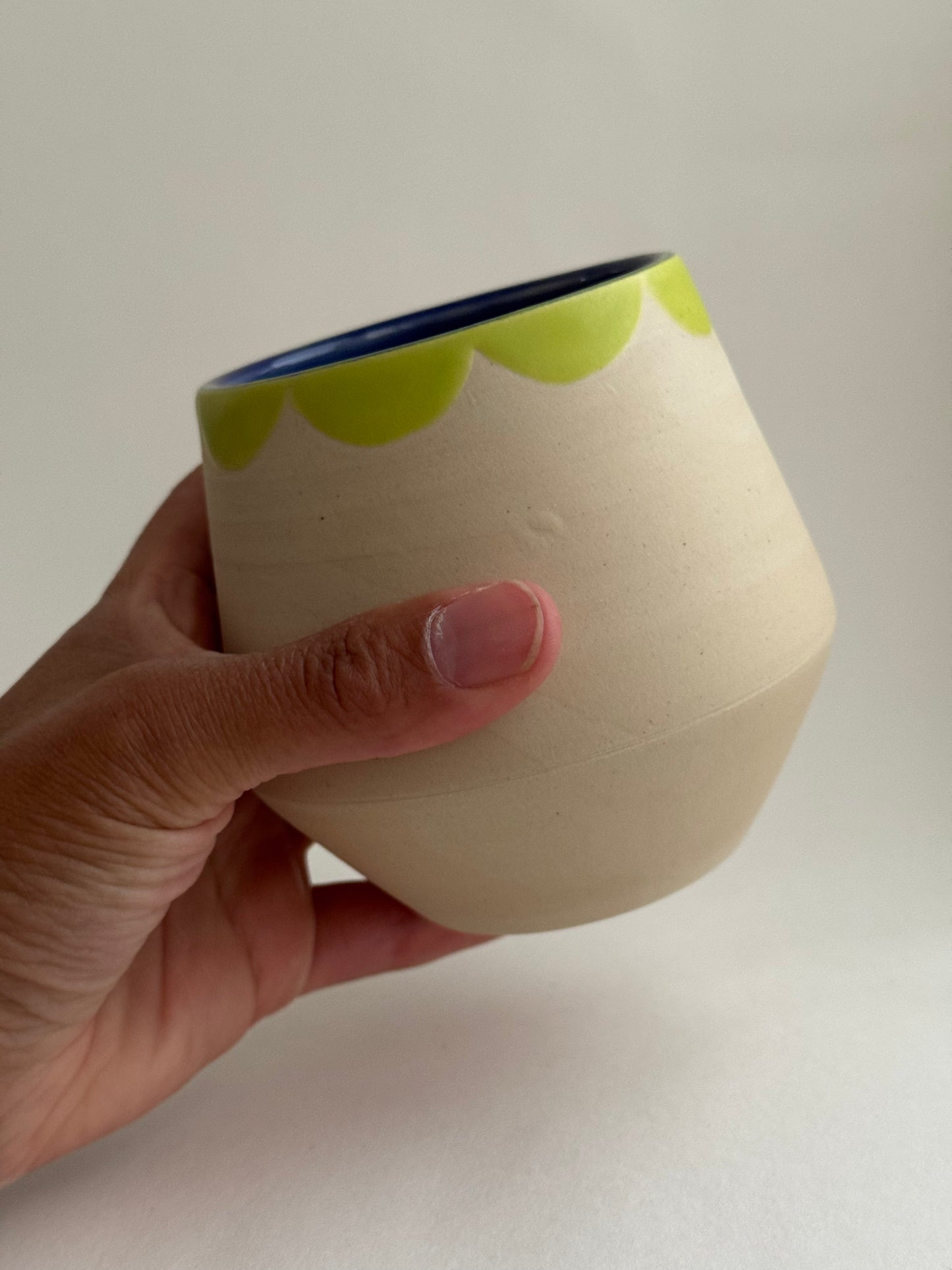 White and Green Cup Green Collar and Blue Interior