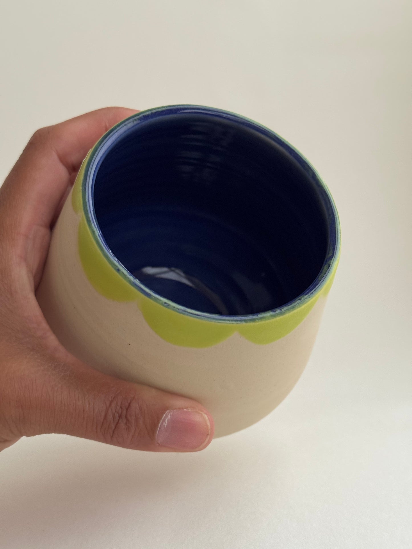 White and Green Cup Green Collar and Blue Interior