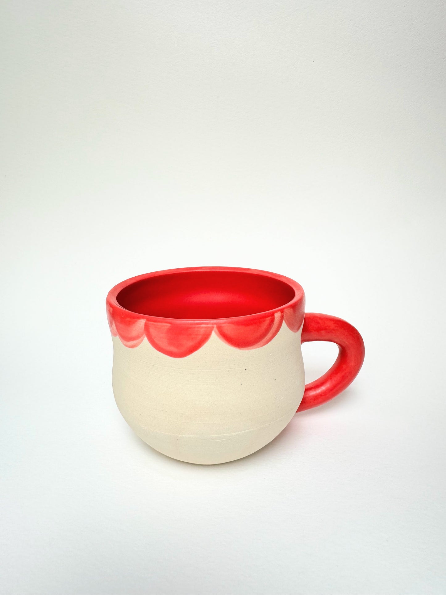 White mug with Neon Red Inside Handle and Petal Colar